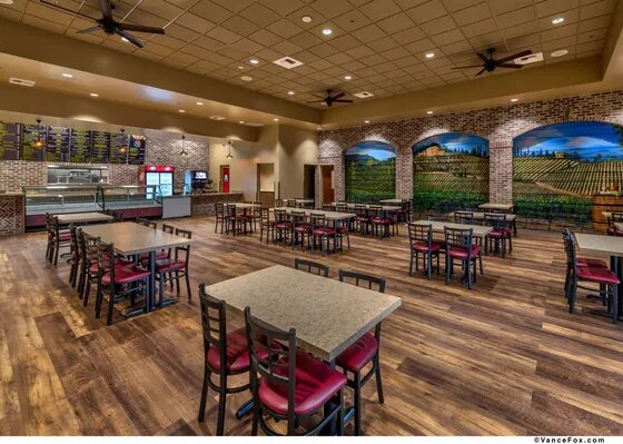 Inside Paisan's — the mural dining room and deli case