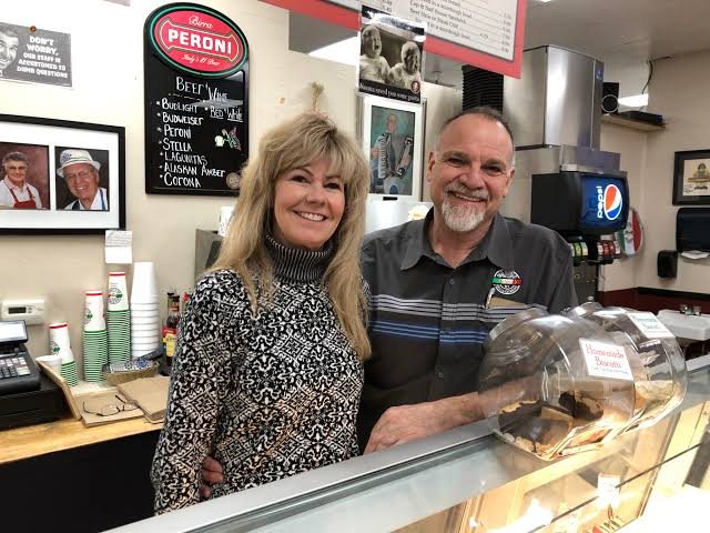 Mike and Angie Angelis behind the counter at the original deli