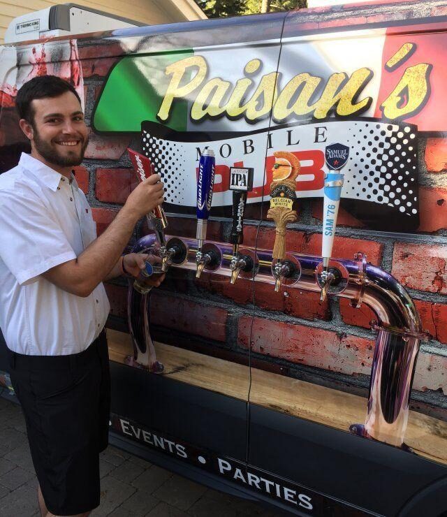 The Mobile Pub trailer with its taps, staffed and pouring