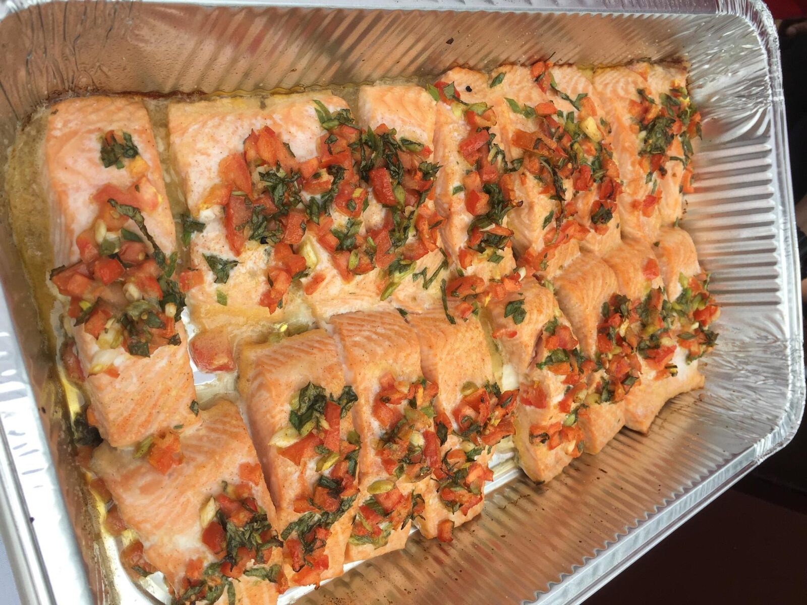 Baked salmon tray from a hot buffet